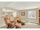 Relaxing basement featuring comfortable leather chairs, ottomans, and soft lighting for a cozy atmosphere at 14191 W Amherst Ave, Lakewood, CO 80228