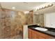 Updated bathroom boasts glass-enclosed tile shower, modern fixtures, and a well-lit vanity area at 14191 W Amherst Ave, Lakewood, CO 80228