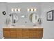 Elegant bathroom with double vanity, modern lighting, and sleek fixtures at 14191 W Amherst Ave, Lakewood, CO 80228