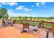 Outdoor deck featuring chairs, tables, and scenic views of the surrounding landscape at 14191 W Amherst Ave, Lakewood, CO 80228