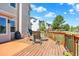 Spacious deck features an outdoor kitchen area with grill and plentiful seating for entertaining guests at 14191 W Amherst Ave, Lakewood, CO 80228