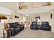 Open-concept living room with a vaulted ceiling and views to other parts of the house at 14191 W Amherst Ave, Lakewood, CO 80228
