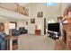 Spacious living room featuring a fireplace, high ceilings, and large windows at 14191 W Amherst Ave, Lakewood, CO 80228