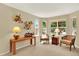 Comfortable living room with two chairs, lamps, and bright windows at 14191 W Amherst Ave, Lakewood, CO 80228