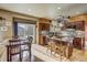 Open kitchen and dining area with stainless steel appliances and lots of natural light at 545 Saber Creek Dr, Monument, CO 80132