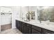 Modern bathroom with double vanity and elegant finishes at 3441 N Denali St, Aurora, CO 80019