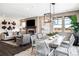 Bright dining area with a large table and modern chandelier at 3441 N Denali St, Aurora, CO 80019