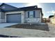 Beautiful single Gathering home featuring stone and siding, a two car garage, and professional landscaping at 3441 N Denali St, Aurora, CO 80019