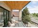Relax on this balcony with black railing and enjoy views of trees and the neighborhood at 1647 N Osceola St, Denver, CO 80204