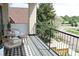 Charming balcony with cozy seating and views of the surrounding neighborhood, perfect for relaxation and outdoor enjoyment at 1647 N Osceola St, Denver, CO 80204
