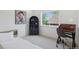 Cozy bedroom featuring a neutral palette, large window, and dedicated desk space at 1647 N Osceola St, Denver, CO 80204