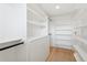 Spacious walk-in closet with custom shelving and drawers, providing ample storage space at 1647 N Osceola St, Denver, CO 80204
