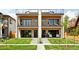 Modern home showcasing its unique architectural design, outdoor patio, and well-maintained lawn at 1647 N Osceola St, Denver, CO 80204