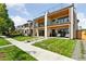 Charming new home exterior with manicured lawn, patio, and modern design elements at 1647 N Osceola St, Denver, CO 80204