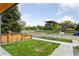 Neat front yard featuring a well-kept lawn, walkway, and attractive landscaping at 1647 N Osceola St, Denver, CO 80204