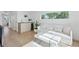 Bright living room features modern decor, a sleek bar area, and scenic outdoor views at 1647 N Osceola St, Denver, CO 80204