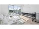 Bright living room with a modern design, adjacent bar, and outdoor access to a balcony at 1647 N Osceola St, Denver, CO 80204