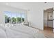 Bright main bedroom with walk-in closet, outdoor space, and neutral decor at 1647 N Osceola St, Denver, CO 80204