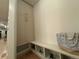 Mud room featuring custom built-in storage, bench seating, and natural lighting at 1647 N Osceola St, Denver, CO 80204