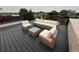 Stylish rooftop seating area with comfortable furniture and a pleasant view of a lake at 1647 N Osceola St, Denver, CO 80204
