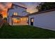 Stunning backyard and patio area with well-manicured lawn and sunset at 1374 S Vine St, Denver, CO 80210