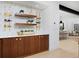 Dining area with custom cabinets, wine storage, and marble tile backsplash at 1374 S Vine St, Denver, CO 80210