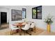 Dining room with modern decor, seating for six, and natural light at 1374 S Vine St, Denver, CO 80210