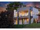 Modern exterior showcasing a unique design with a balcony, stylish entrance, and manicured front yard at 1374 S Vine St, Denver, CO 80210