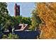 Scenic rooftop view of a historic building with a clock tower framed by trees and foliage at 1374 S Vine St, Denver, CO 80210