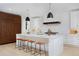 Bright kitchen features a waterfall island with pendant lighting and stainless steel appliances at 1374 S Vine St, Denver, CO 80210