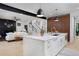 Kitchen island with barstool seating and seamless flow into the living room at 1374 S Vine St, Denver, CO 80210