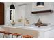 This bright kitchen features a waterfall island with pendant lighting and stainless steel appliances at 1374 S Vine St, Denver, CO 80210