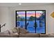 Comfortable living room with a sliding glass door leading to a serene outdoor deck with mountain views at 1374 S Vine St, Denver, CO 80210