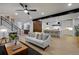 Open-concept living room with modern finishes flowing into a bright kitchen area at 1374 S Vine St, Denver, CO 80210