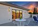 Relaxing roof deck with a white table and chairs, perfect for enjoying outdoor meals and sunset views at 1374 S Vine St, Denver, CO 80210