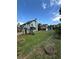 Large backyard with playset, shed, garden, and fencing, providing ample space for outdoor activities and relaxation at 4362 Denmark Ct, Denver, CO 80239
