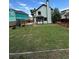 Expansive backyard featuring a well-maintained lawn, play structure, and partial fencing for privacy at 4362 Denmark Ct, Denver, CO 80239
