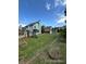 Large, grassy backyard with a playset and a storage shed, offering ample space for outdoor activities and storage at 4362 Denmark Ct, Denver, CO 80239