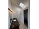 Bathroom featuring a granite countertop, modern lighting, and a walk-in closet at 4362 Denmark Ct, Denver, CO 80239