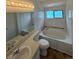 Bright bathroom with a tub, white tile and vanity with plenty of light at 4362 Denmark Ct, Denver, CO 80239