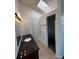 Bright bathroom with a skylight, a granite countertop, and a walk-in closet, offering a spa-like experience at 4362 Denmark Ct, Denver, CO 80239