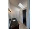 Bathroom featuring a granite countertop, modern lighting, and a walk-in closet at 4362 Denmark Ct, Denver, CO 80239
