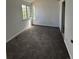 Bright bedroom featuring neutral carpeting, a window for natural light, and a closet, offering a comfortable retreat at 4362 Denmark Ct, Denver, CO 80239