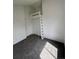 Bedroom featuring carpeted floors, a window and closet with built-in ladder at 4362 Denmark Ct, Denver, CO 80239