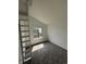 Bedroom featuring a large window with a view, carpeted floors, and a sleeping loft at 4362 Denmark Ct, Denver, CO 80239