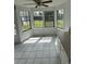 Bright breakfast nook with large windows offering backyard views, and tile flooring creating a cheerful space for morning meals at 4362 Denmark Ct, Denver, CO 80239