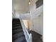 Spacious foyer with carpeted floors, staircase, and high ceilings, creating an open and welcoming entrance at 4362 Denmark Ct, Denver, CO 80239
