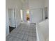 Bright hallway with tile flooring leads to bedrooms and a bathroom at 4362 Denmark Ct, Denver, CO 80239