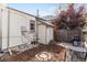 Private fenced backyard with a stone paver patio and mulched planting area at 3953 Tejon St, Denver, CO 80211