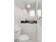 Charming powder room features white wainscoting and a decorative bowl sink at 3953 Tejon St, Denver, CO 80211